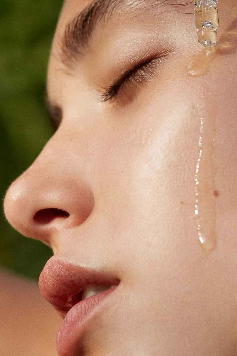 image of a woman using botanical products for eye care