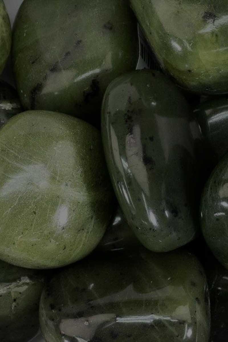 close up image of green wet pabbles